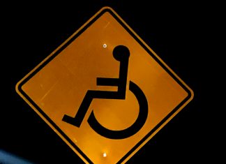 New signs on East Ave. warn drivers to use caution for child with special needs