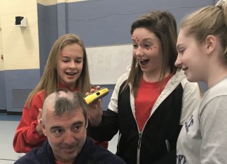 Middle School teacher lets students shave his head for cancer fundraiser