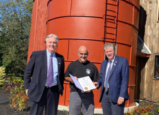 McKee congratulates owners, presents citation following successful opening of new Beef Barn