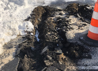 Parking lot collapses beneath plow in latest problem at North Smithfield’s new Town Hall