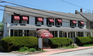 Historic building holding Tavern on Main purchased by owner of neighboring gas station