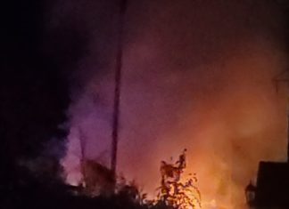 Car catches fire after crash into Memorial Town Hall