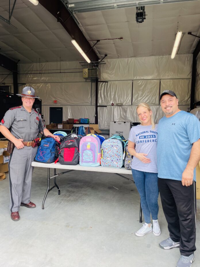 Colonel Kyle Shipley, left, with Glad Tidings Community Church Children's Director Amy-Beth Vasconcelos and her husband, GTCC Kids Church Coordinator Antonio Vasconcelos.