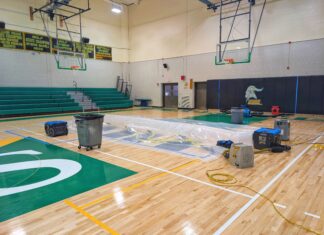 New – and costly – NSHS gymnasium floor hit by roof leak, shows wide gaps from contracting
