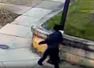 Town announces enhanced security as suspect in Brown University shooting remains at large