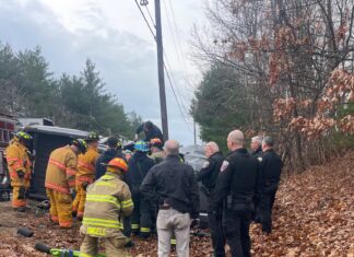 Responders use jaws of life to rescue driver following rollover crash on Broncos Highway