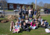 Volunteers plant a tree – and the seeds of an eco-conscious mindset – with students at Callahan School